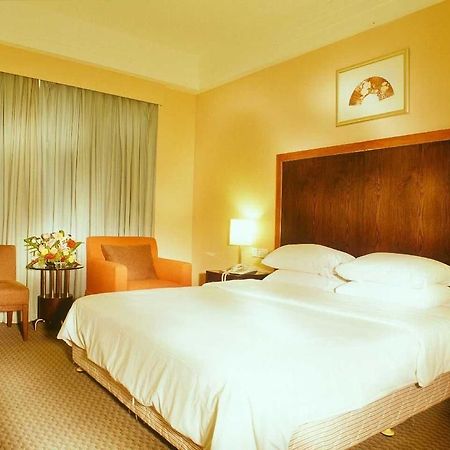 Golden Coast Lawton Hotel Haikou  Quarto foto